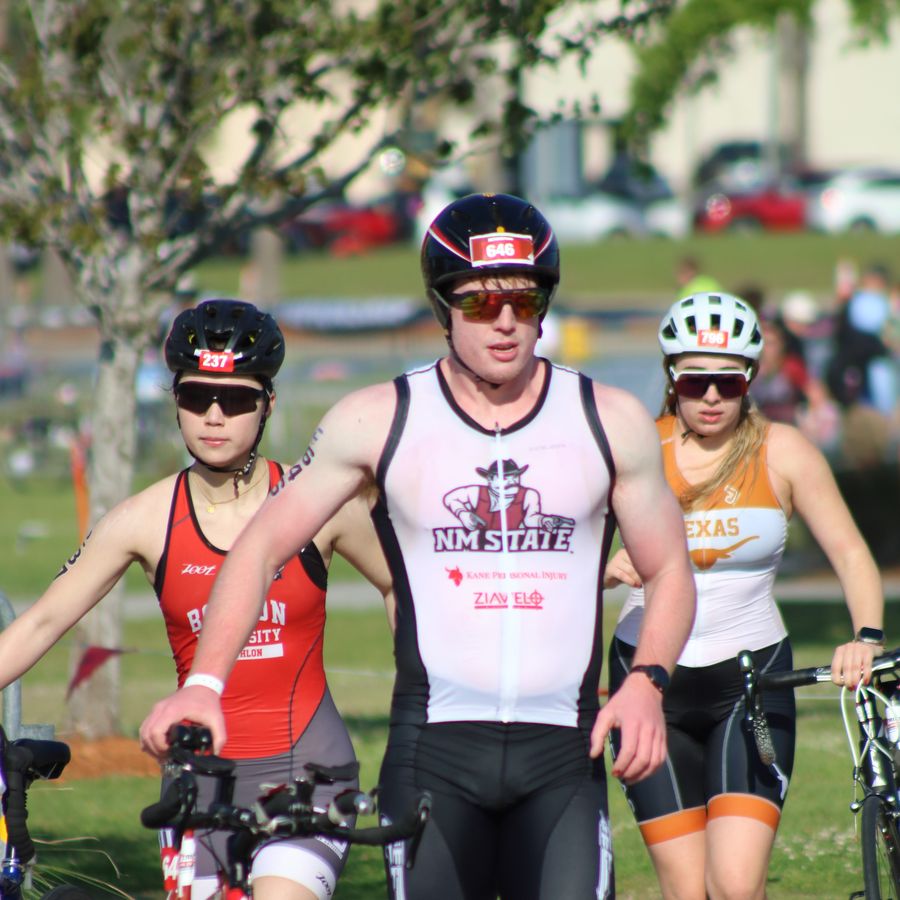 Colin running his bike to transition at CCNC Nationals